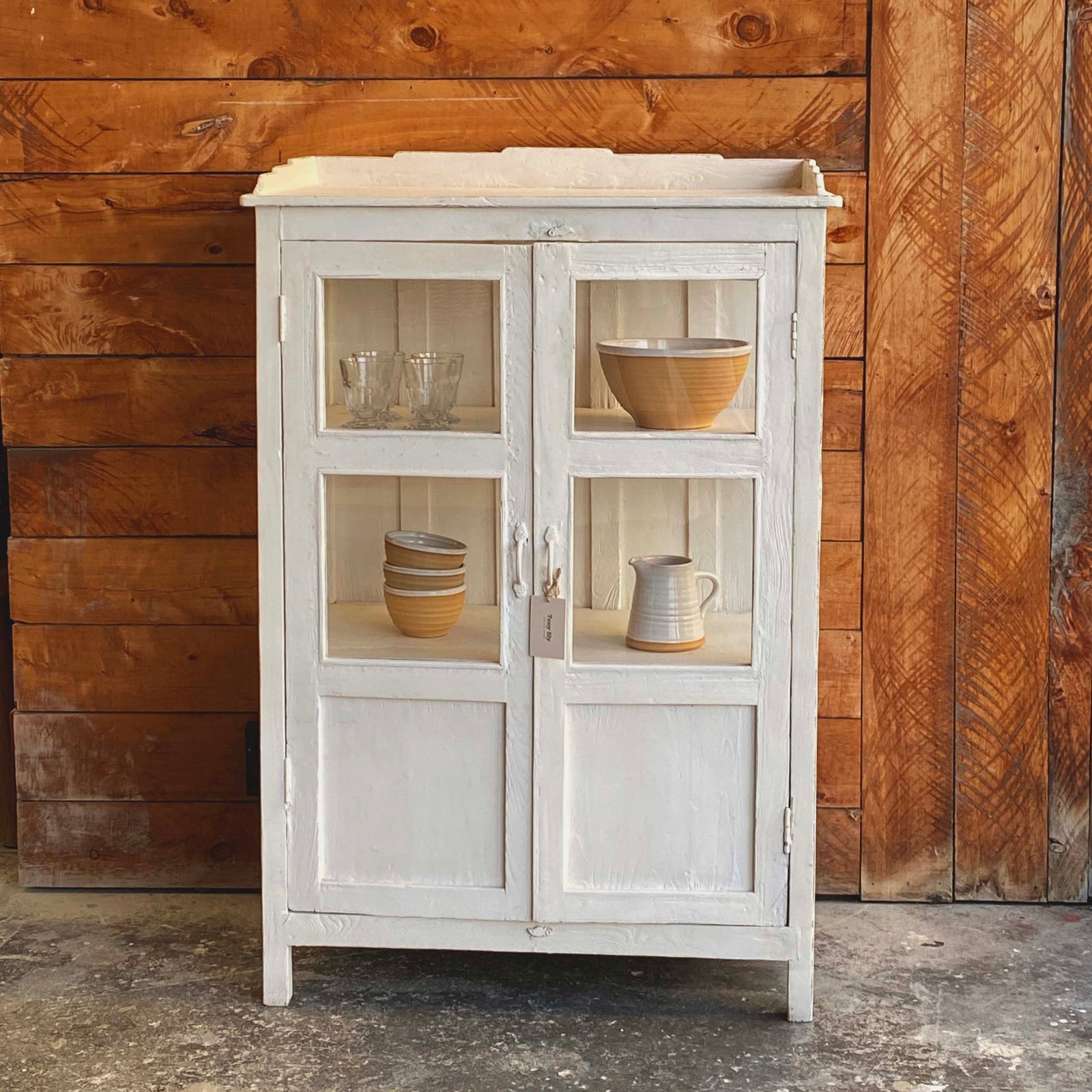 White wooden cabinet with glass doors 